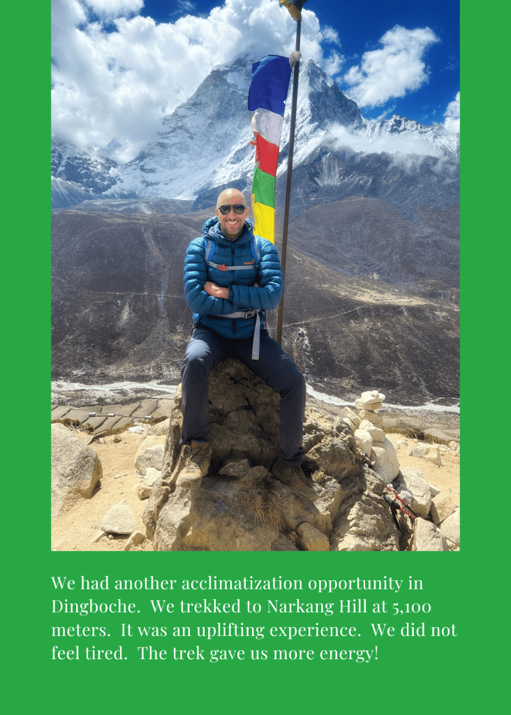 Mohamed Isa on Narkang Hill above Dingboche at 5,100 meters, with prayer flags and snow peaks