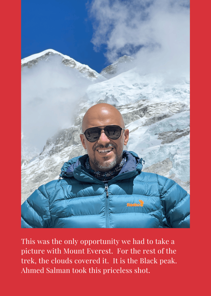 Mohamed Isa with the summit of Mount Everest behind him, photographed by Ahmed Salman