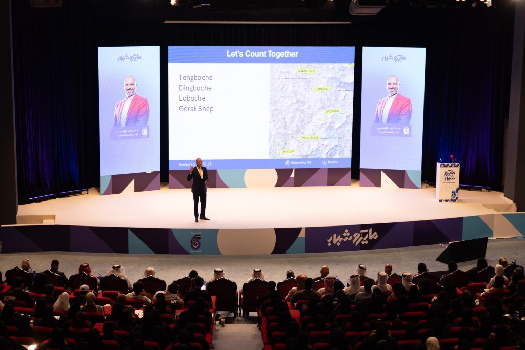 Mohamed Isa speaking on stage