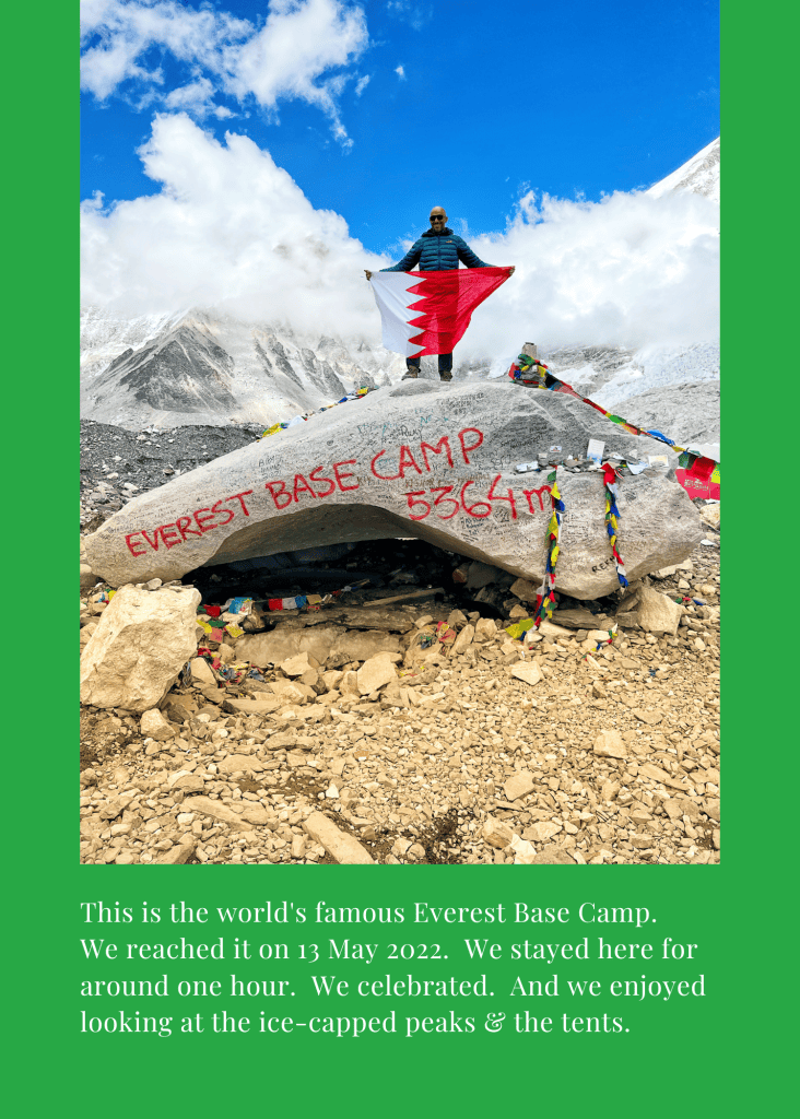 Mohamed Isa holding the Bahrain flag on the Everest Base Camp rock at 5,364 meters, 13 May 2022