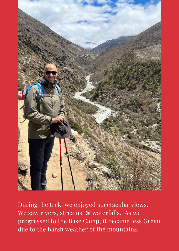 Mohamed Isa above a river valley on the trek, with the Bahrain flag on his backpack