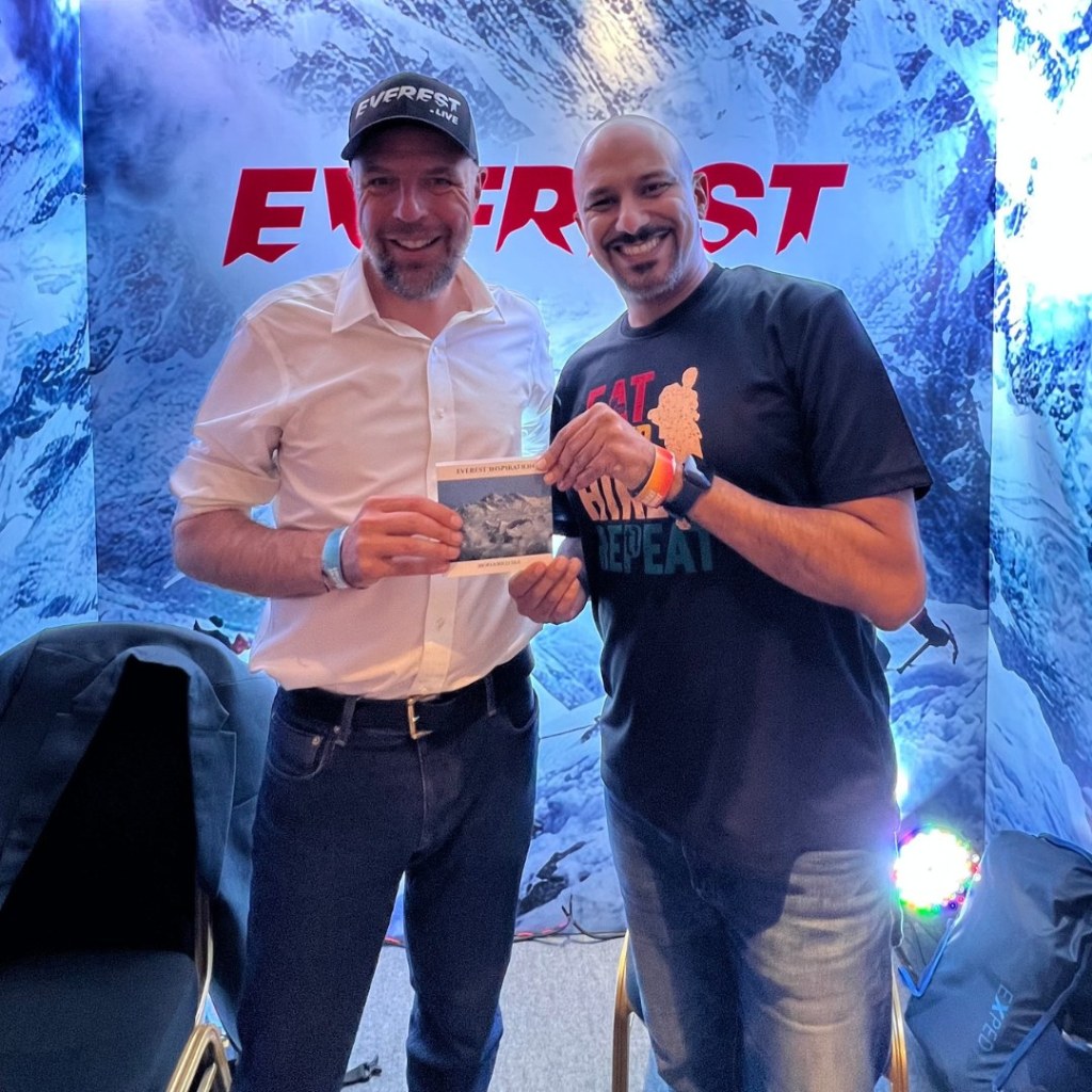 Mohamed Isa with a fellow attendee at the Everest Live booth at the Ascent Summit